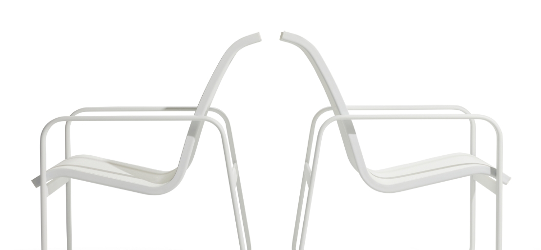 Two modern, minimalist white chairs from the Stori Modern Sequel collection stand back to back against a plain white background. These classic sling chairs feature sleek metal frames with curved armrests and slightly angled backrests.