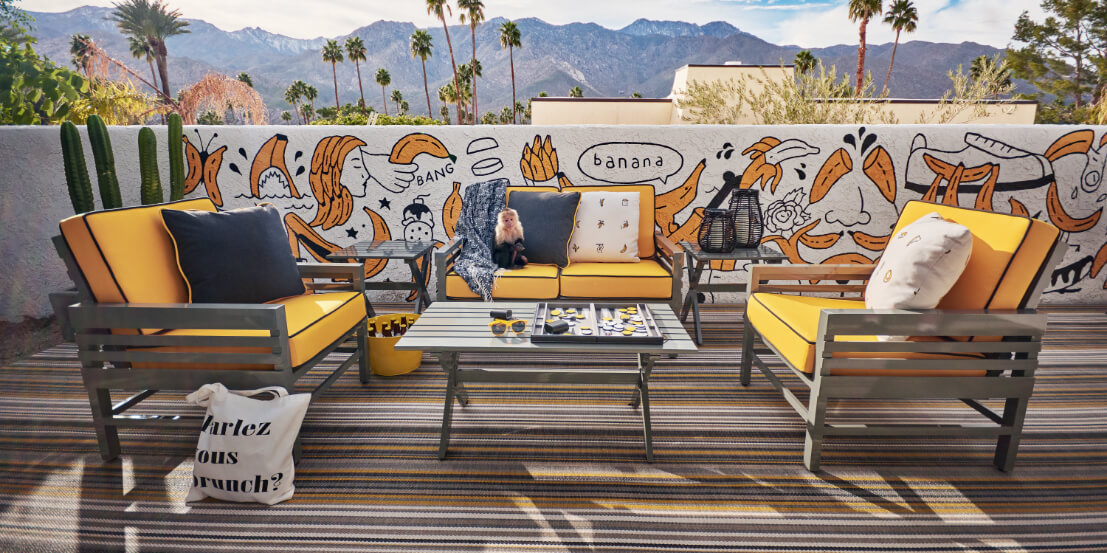 graphic outdoor seating with banana mural in palm springs